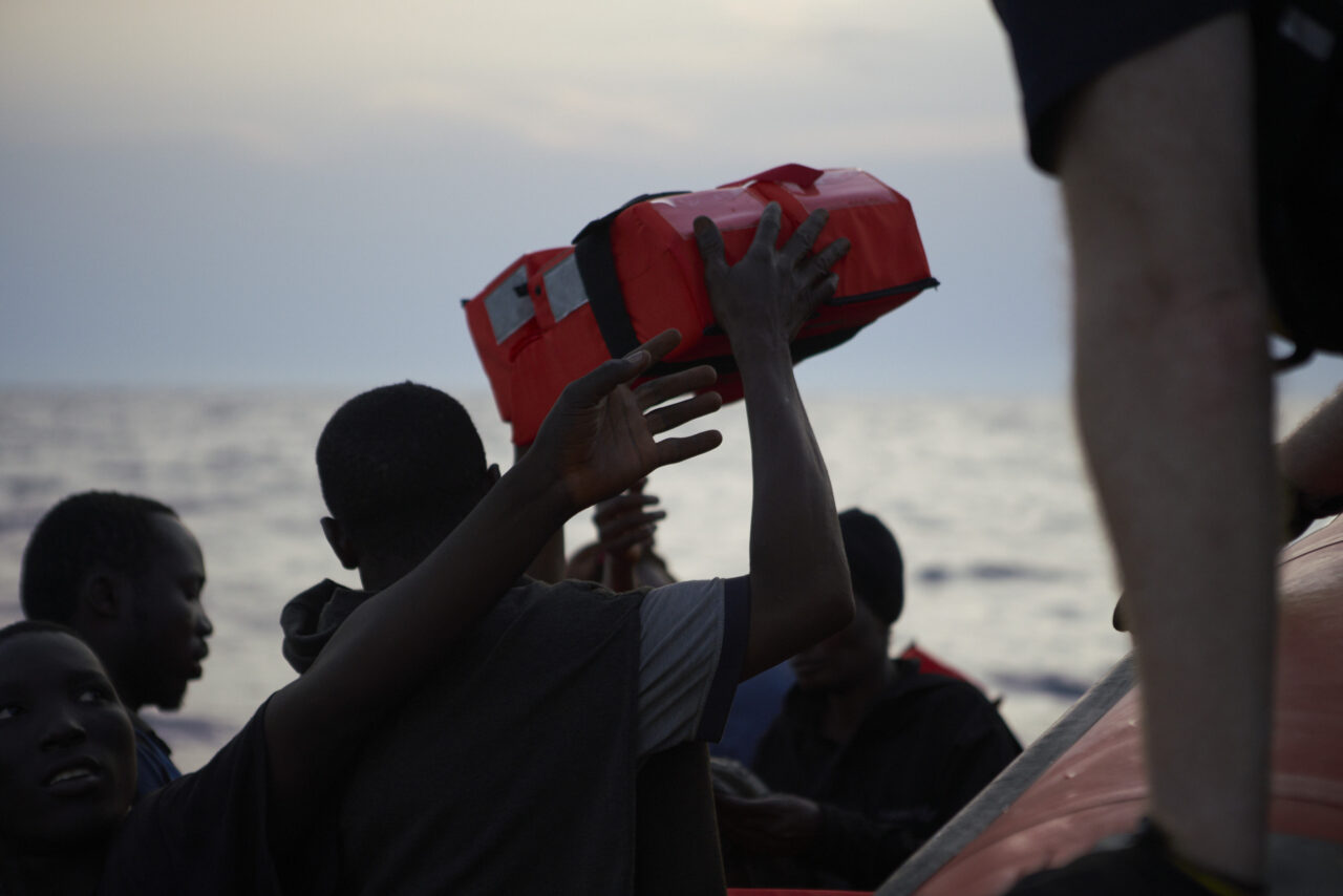 Survivors are handed out life vests.